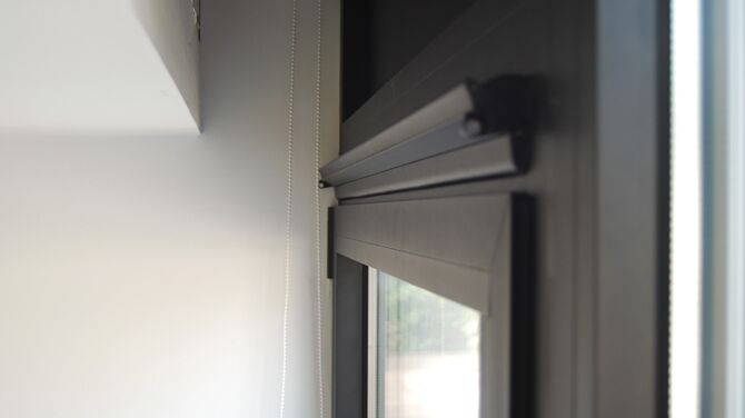 Interior view of Ventalis, our ventilation system, integrated in a black window.