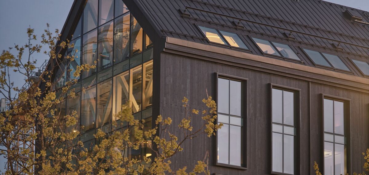 Habitat 7 Building in Sweden, with tree and wood façade.