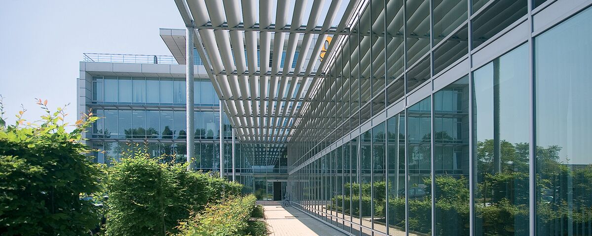 BriseSoleil solar shading outside a glass-and-aluminium office complex.