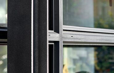 Detail of black aluminium window profiles, featured in the Italian Treviso villa.